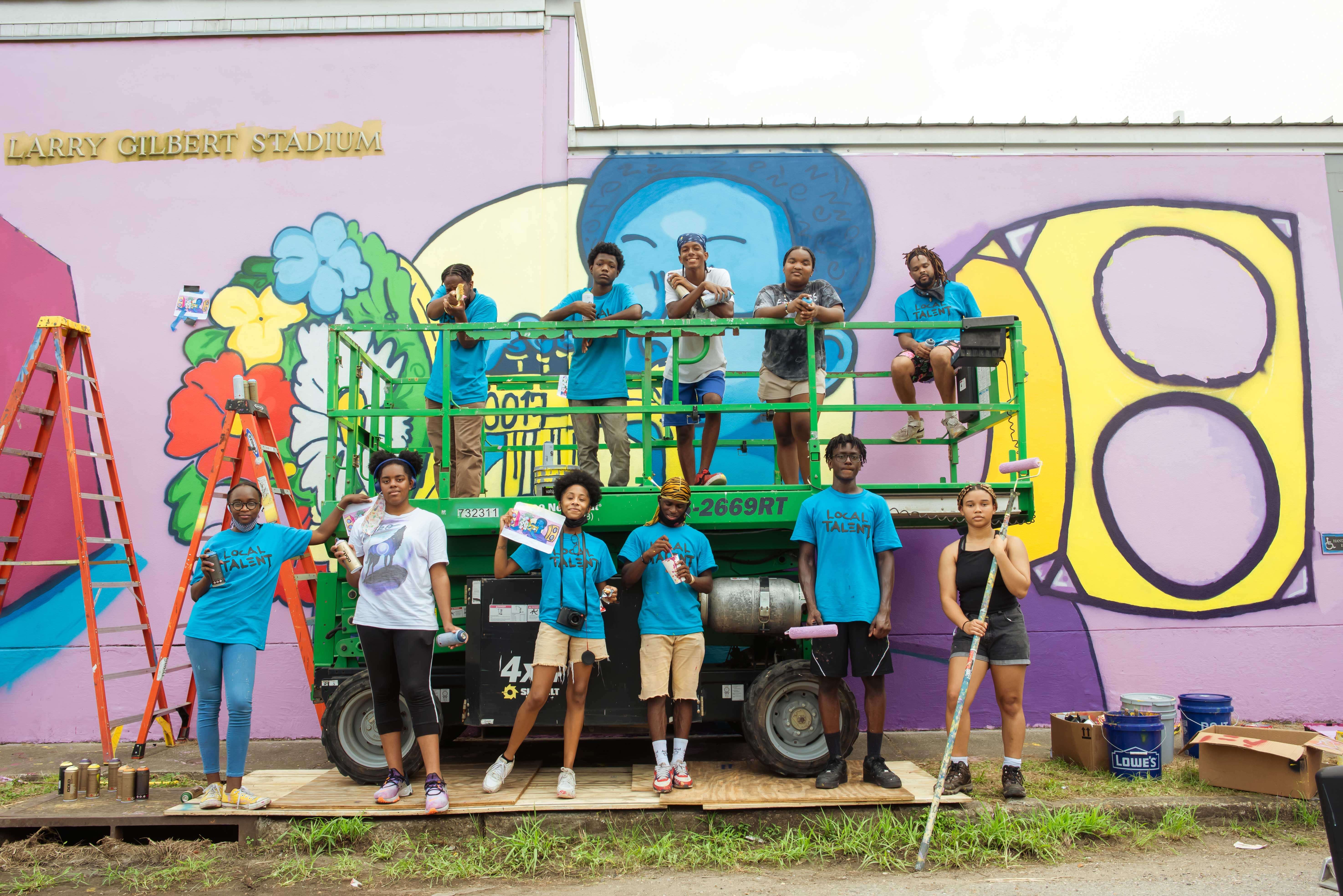 Eternal Seeds creating an outdoor mural